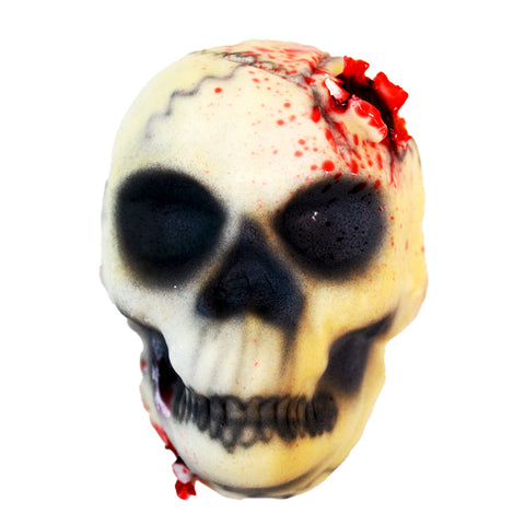 Skull-shaped cupcake with black eye sockets and red accents on a white background